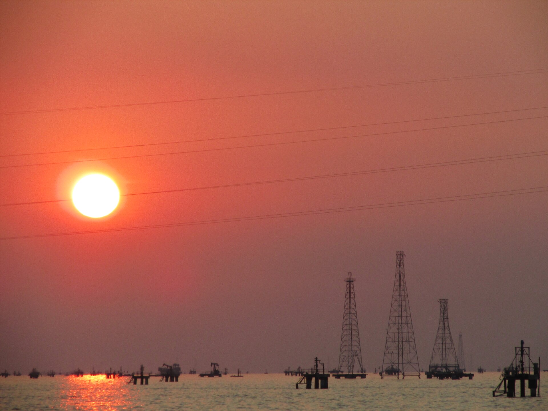 Oil derricks on Lake Maracaibo at sunset, Lagunillas, Zulia